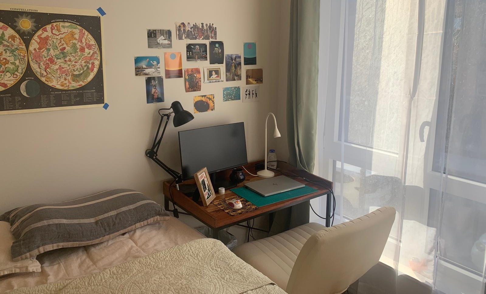 Bedroom workspace in a small rental apartment with a desk by the window, showing multiple daily functions sharing one space without full separation.